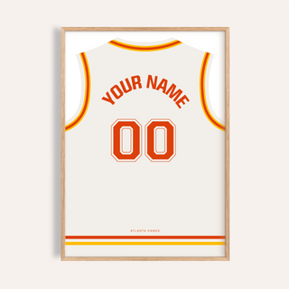 Framed print close-up of a basketball jersey poster in white with red and yellow trim showing custom name and number