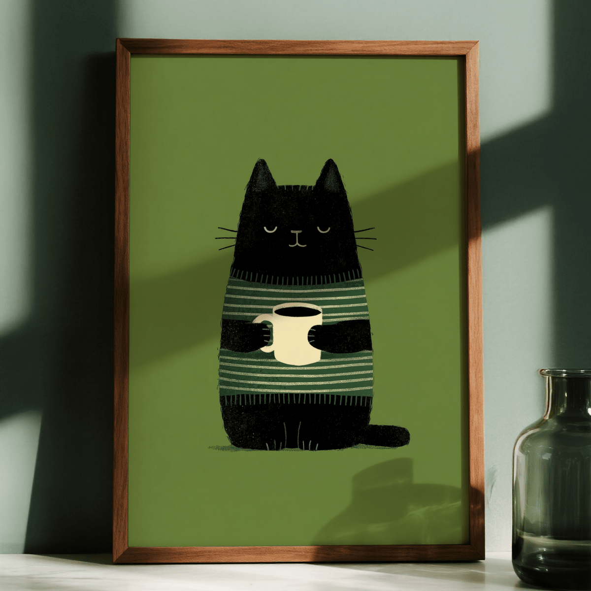 Framed Cat Coffee wall art with black cat holding cream cup against green background with glass bottle nearby