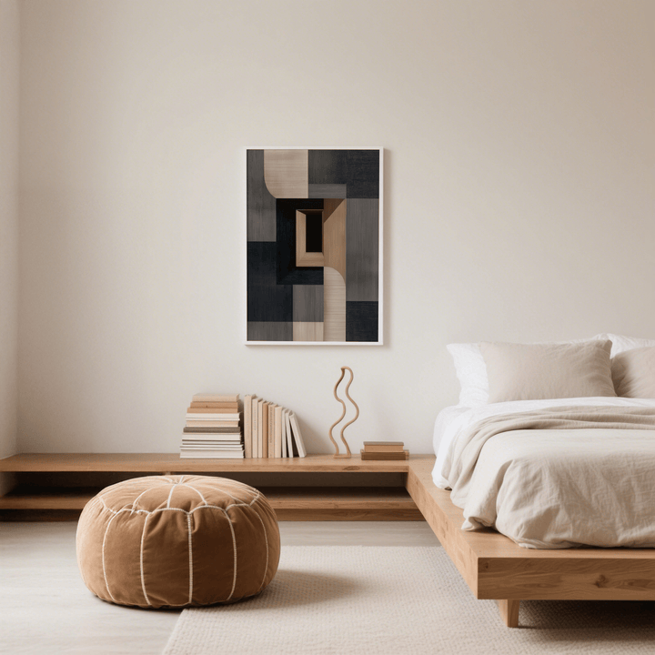 Abstract Wabi Sabi Print on wall with muted beige and black geometric shapes in a minimalist bedroom above a wooden shelf