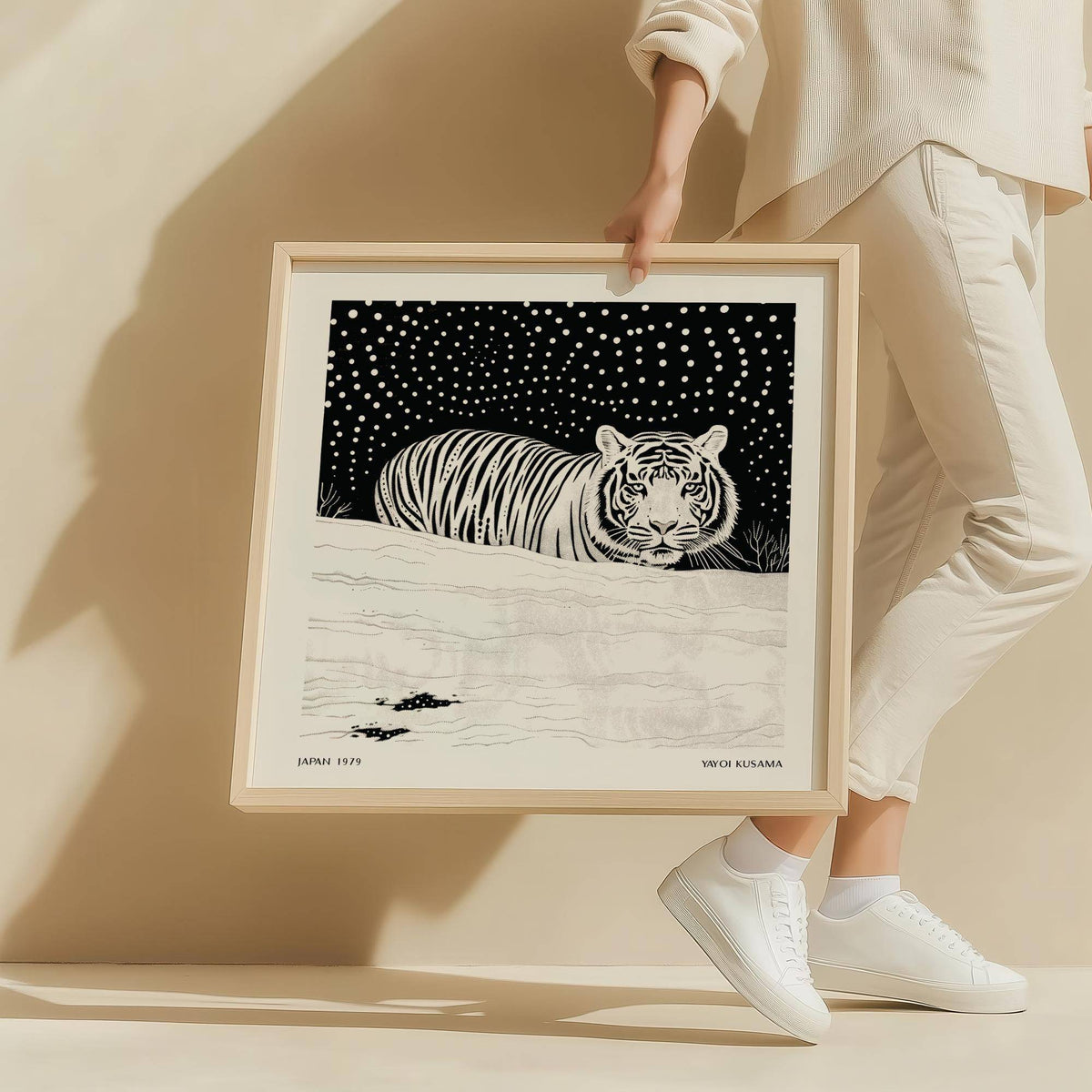 Framed Art White Tiger print with black and white minimalist illustration held by person in light clothes