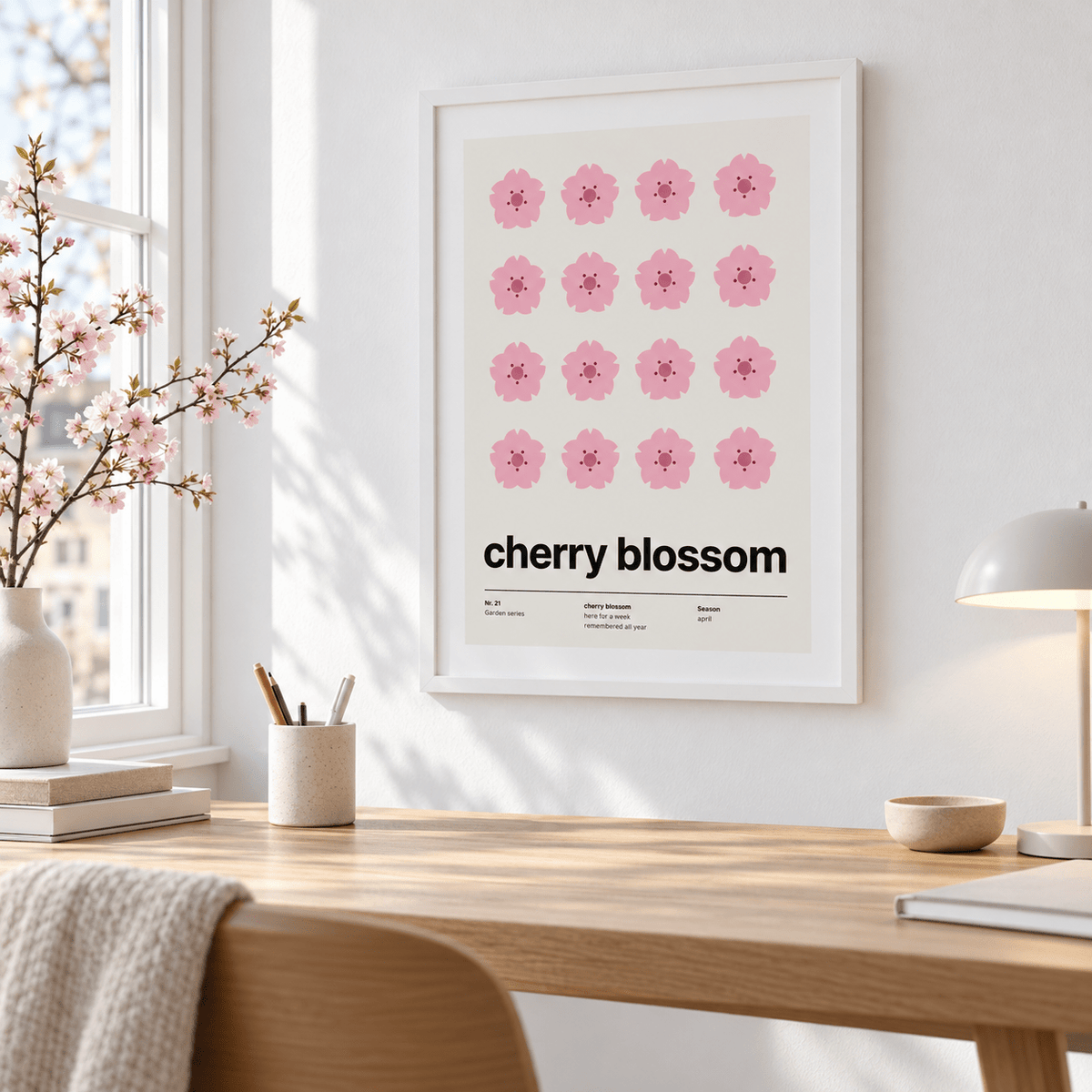 Swiss style cherry blossom print above a desk in a bright home office