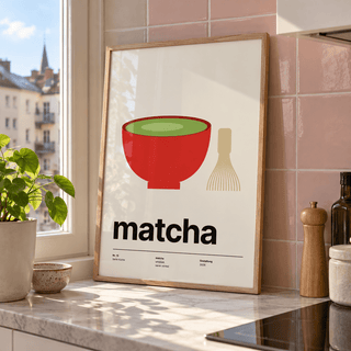 Swiss style matcha typography print in a kitchen window against a pink wall