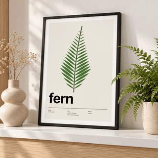 Swiss style fern leaf print leaning on a picture ledge with books