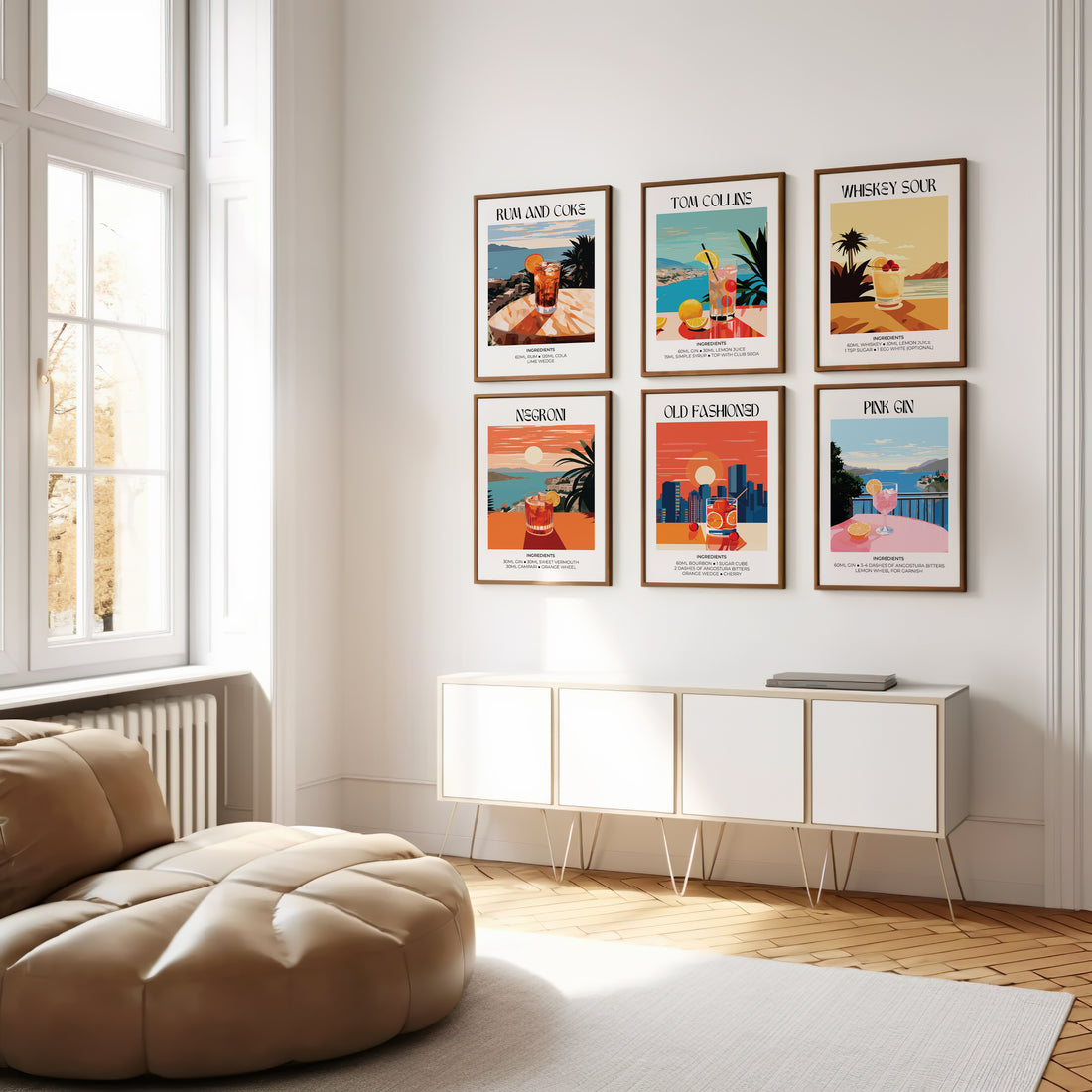 Grid of six colourful cocktail prints in wooden frames hung evenly above a white sideboard in a sunny room