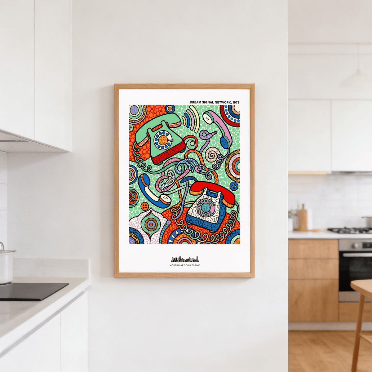 Vintage Telephone Art Print leaning on a white kitchen wall with modern cabinets and wooden floor visible
