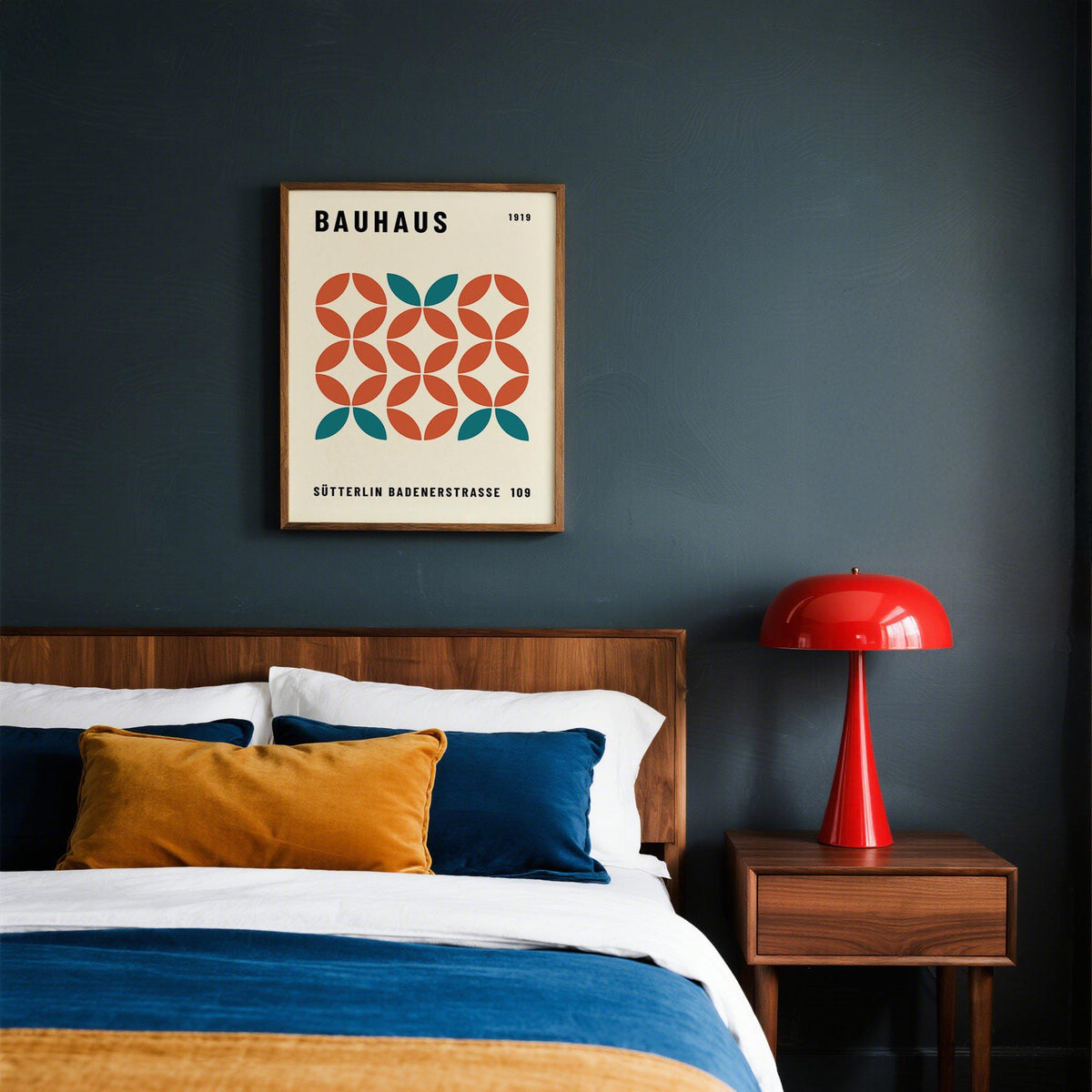 Modern Geometric Wall Art framed print close-up with teal and terracotta shapes above a double bed with cushions