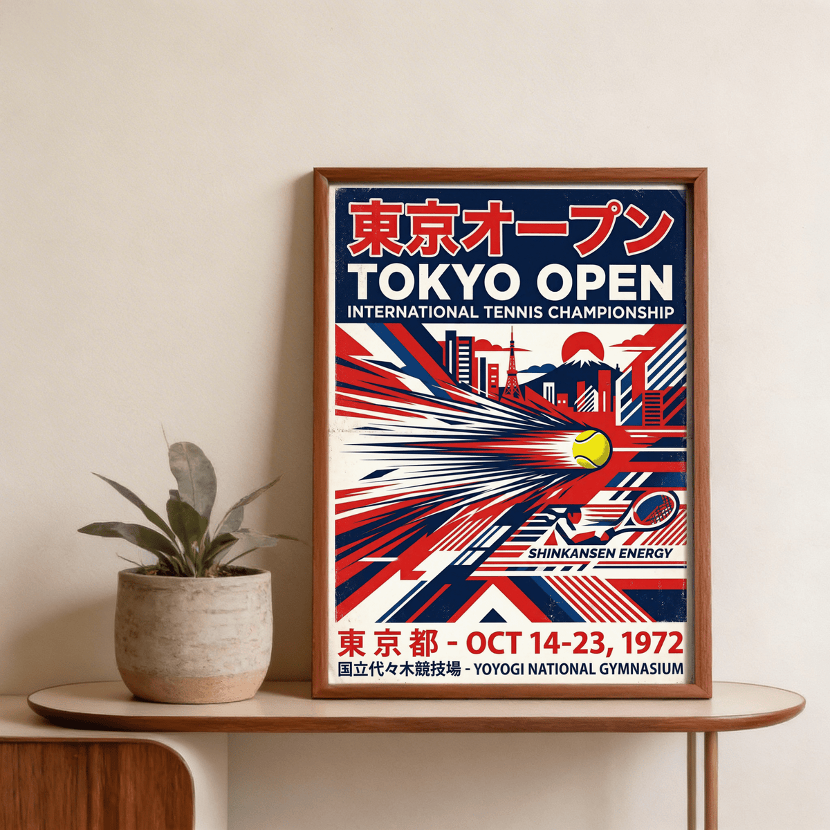 Framed Tokyo Open Tennis Print with retro red and blue design above a plant pot on a wood sideboard
