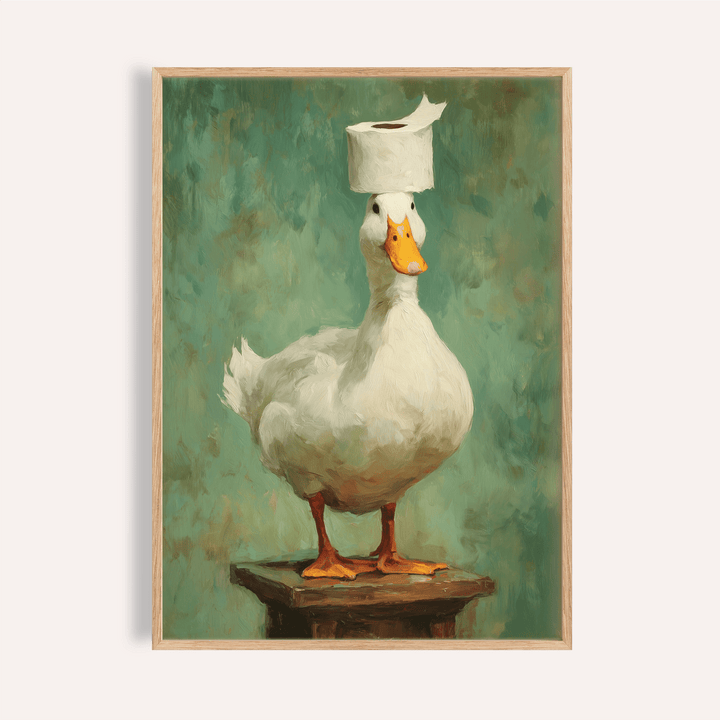 Framed print of a white duck with orange feet and beak wearing a roll of toilet paper on its head against a green background