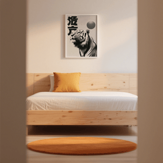 Black And White Tiger Print on a wall above a bed with white linen and an orange cushion and rug