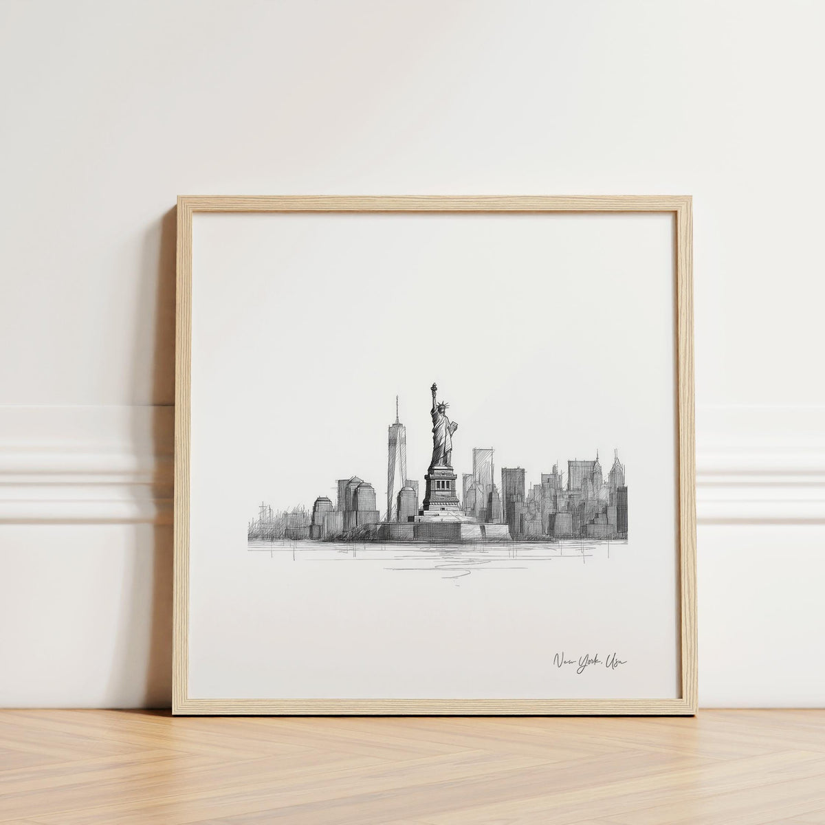 Statue of Liberty Print showing a line-art illustration of the statue and New York skyline in black and grey leaning against a skirting