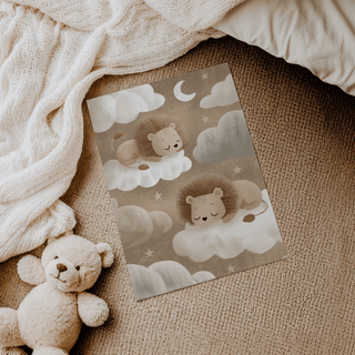 Sleeping lions on clouds in soft beige and white tones on textured fabric background with teddy bear