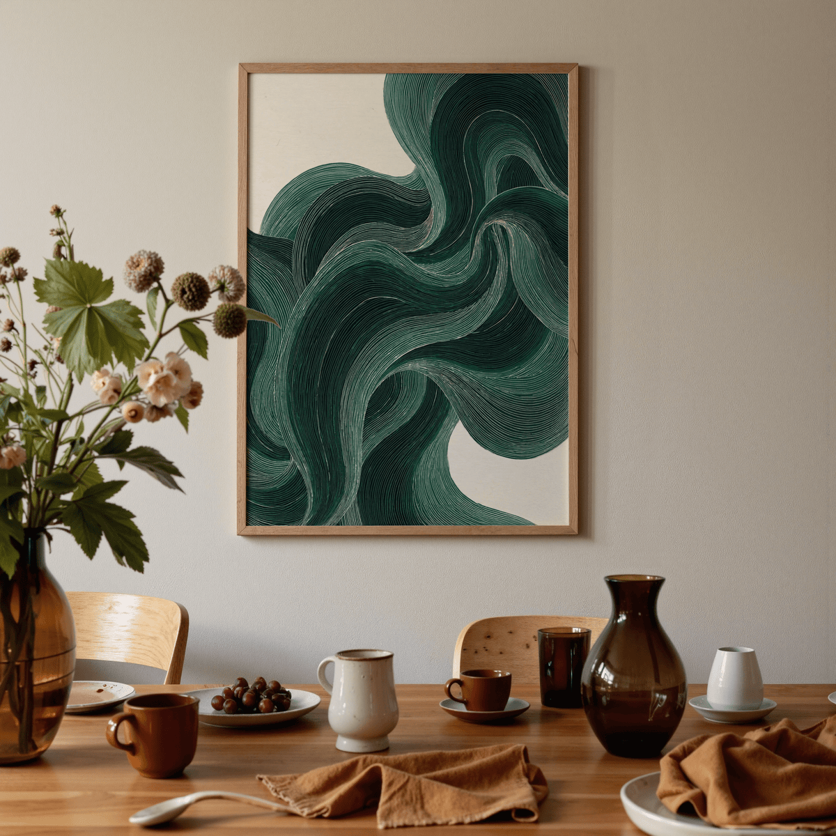 Wavy Poster framed print with dark green wavy lines on a cream background above a dining table with crockery and a brown vase