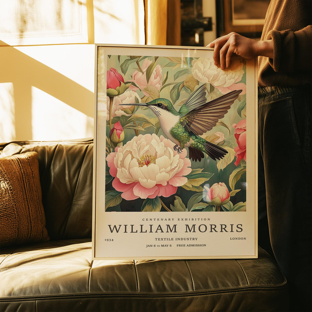 Hummingbird Prints showing a hummingbird and peonies with green and pink tones held above a sofa