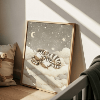 Zebra nursery art print leaning on a wooden floor with a cushion featuring beige and brown stripes nearby