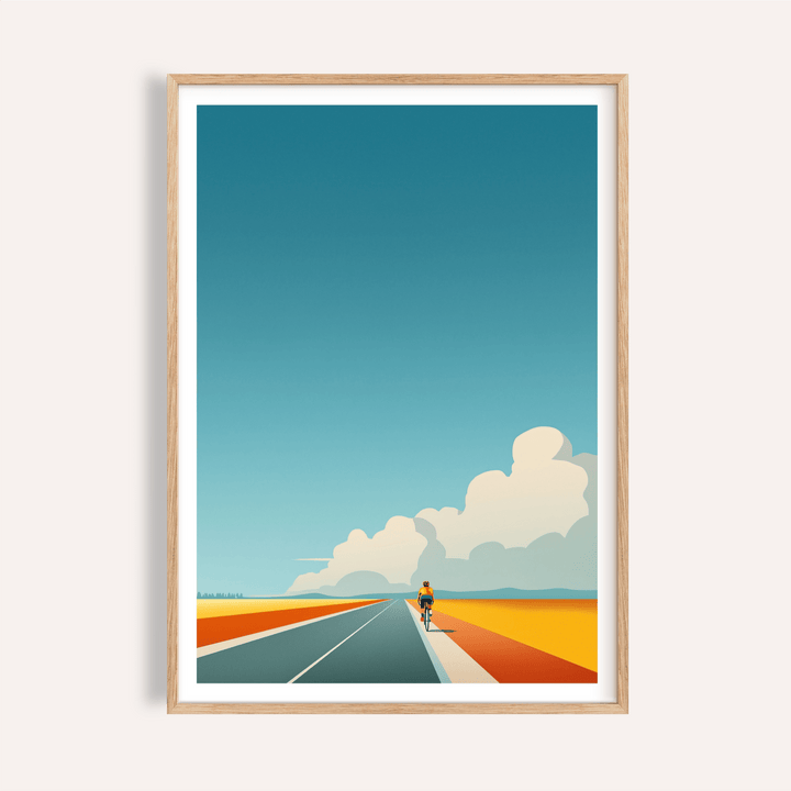 Framed print close-up of Bicycle Journey wall art showing cyclist on blue and orange road with blue sky