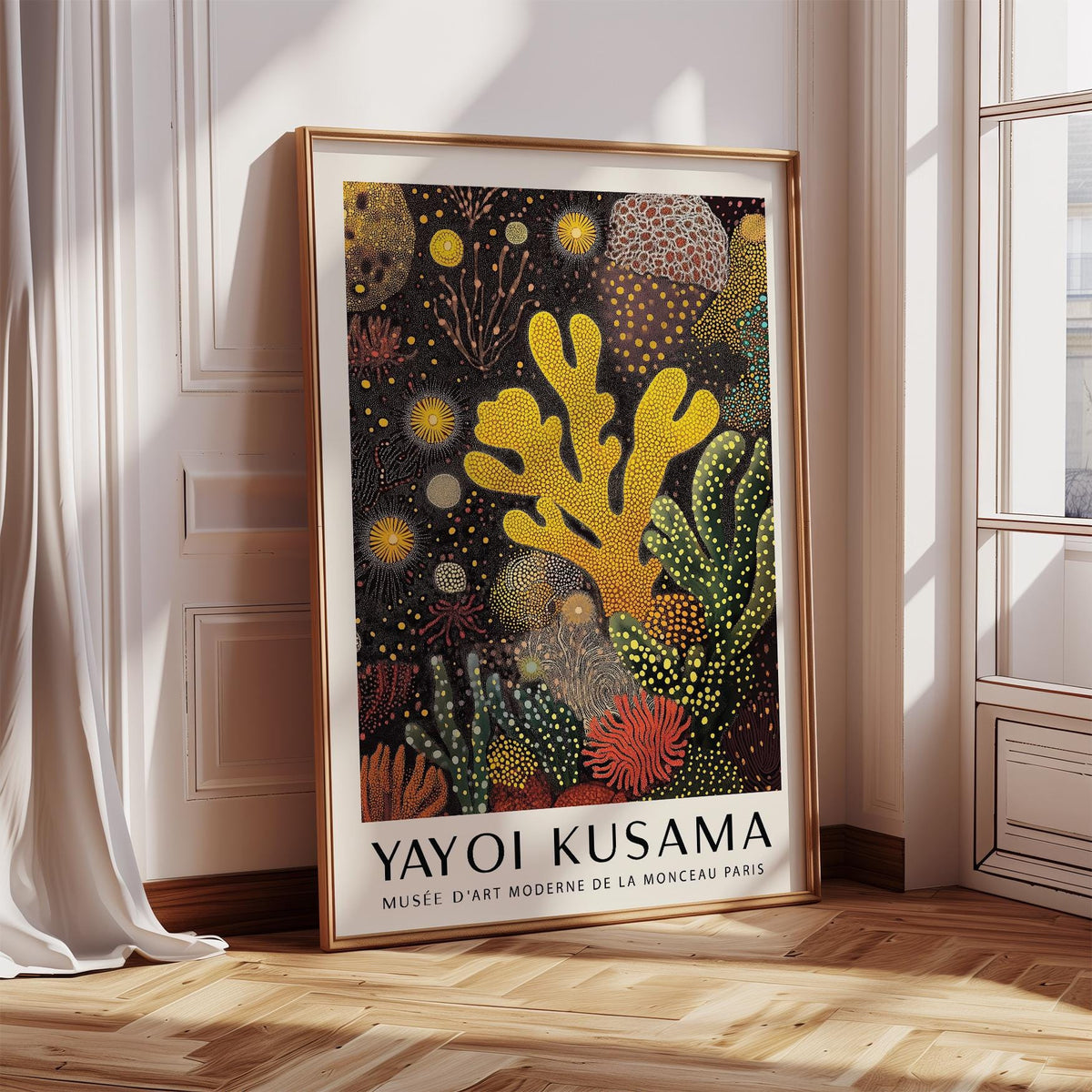 Framed print leaning with coral reef painting in orange green and yellow beside window