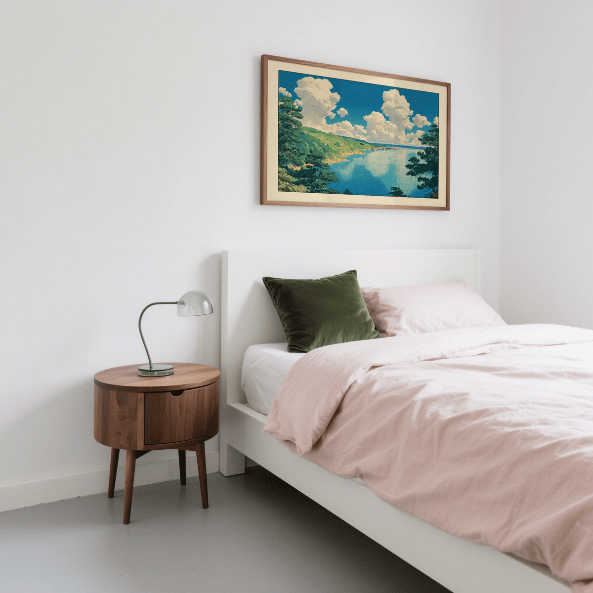 Hasui Kawase Seascape Print framed on a white wall with a green cushion on the bed and a wooden bedside table