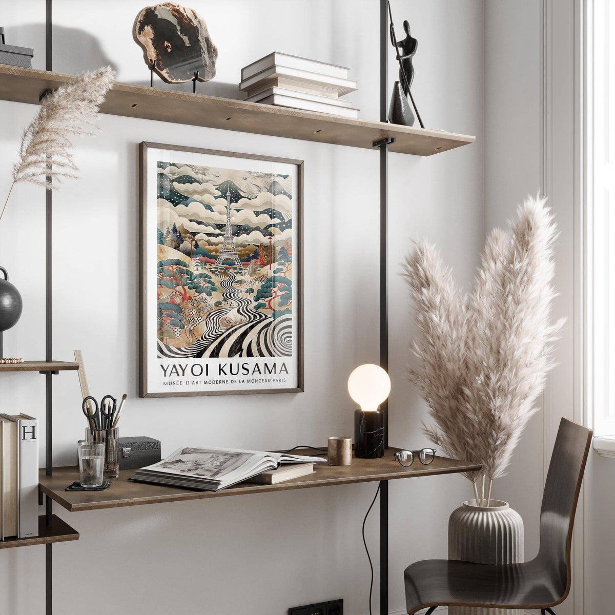 Eiffel Tower Art framed print with surreal black and white patterned river above a desk with books and lamp in a bright room