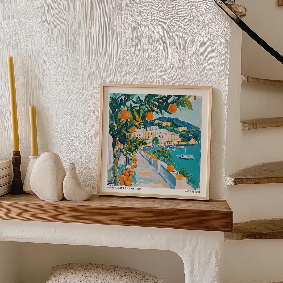 Art prints of Italy framed print of an orange tree by seaside path with teal and orange tones on a wooden mantle