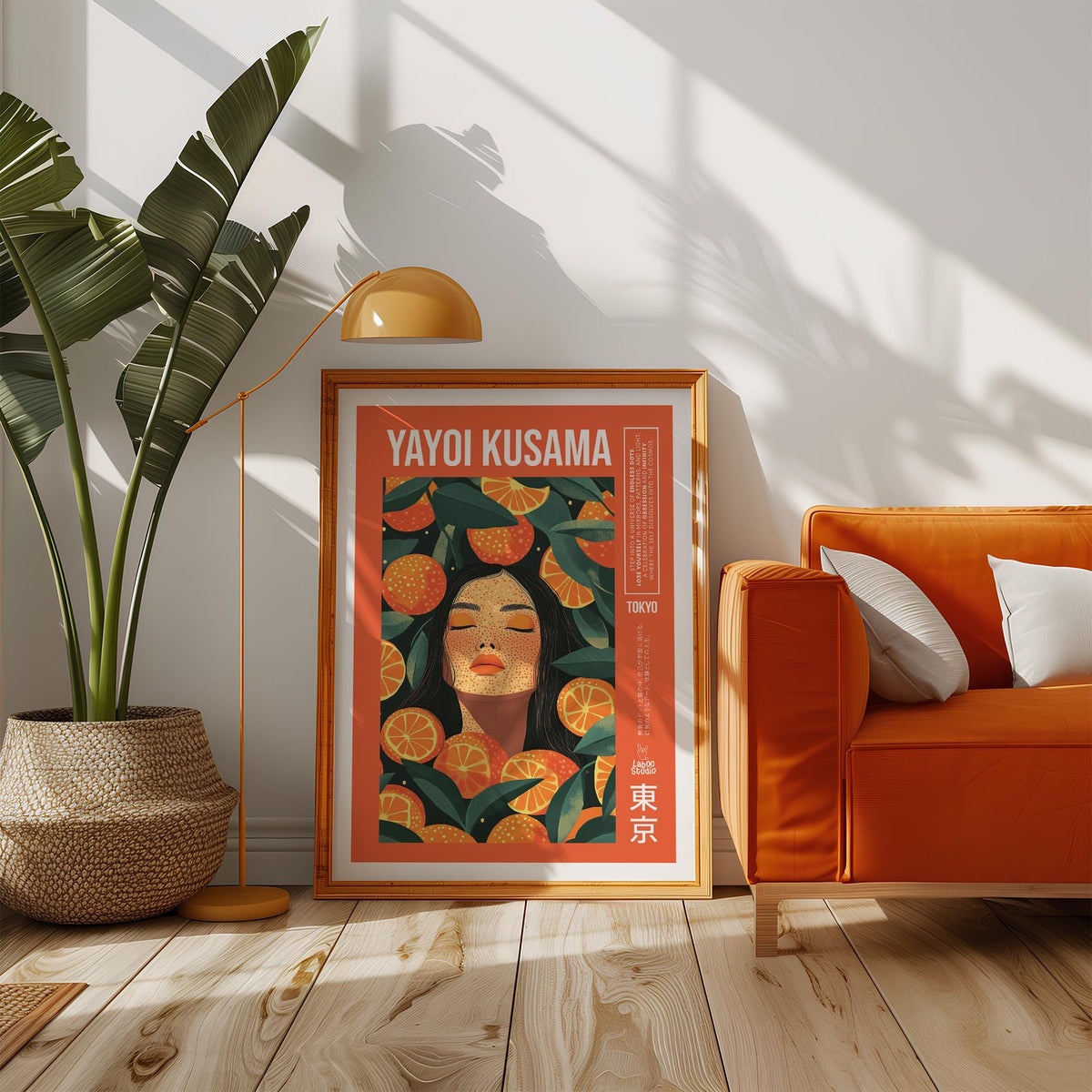 Print leaning on floor of a woman with orange slices in warm orange and green tones near an orange sofa