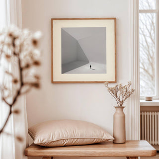 Square art prints framed print of a tiny solitary man in a grey minimalist space above a wooden table
