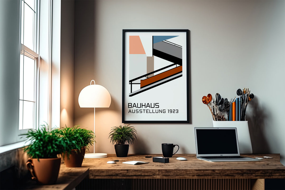 Bauhaus Exhibition Poster 1923 print on a wall in a study with plants and a laptop on a wooden desk