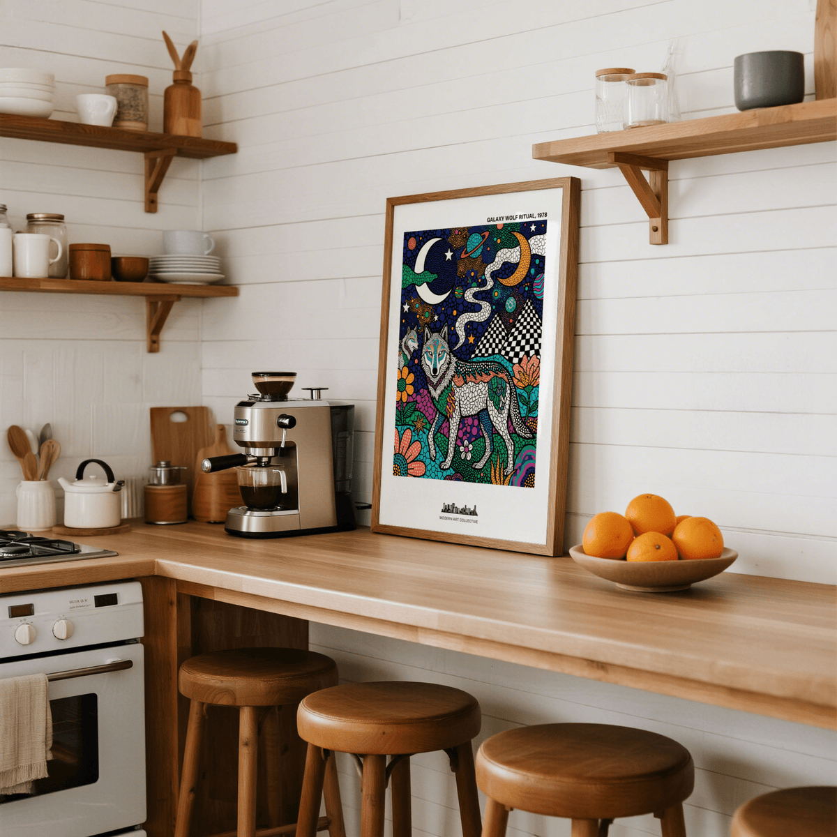 Wolf Galaxy wall art leaning on a kitchen counter with a bowl of oranges