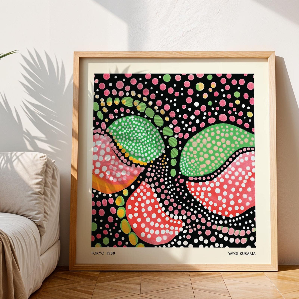 Framed Green Pink Art with abstract colourful fruit shapes and white dots near a sofa