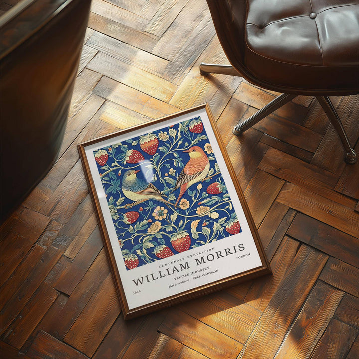 Vintage wall art of two birds with red strawberries and green leaves lying on a wooden parquet floor