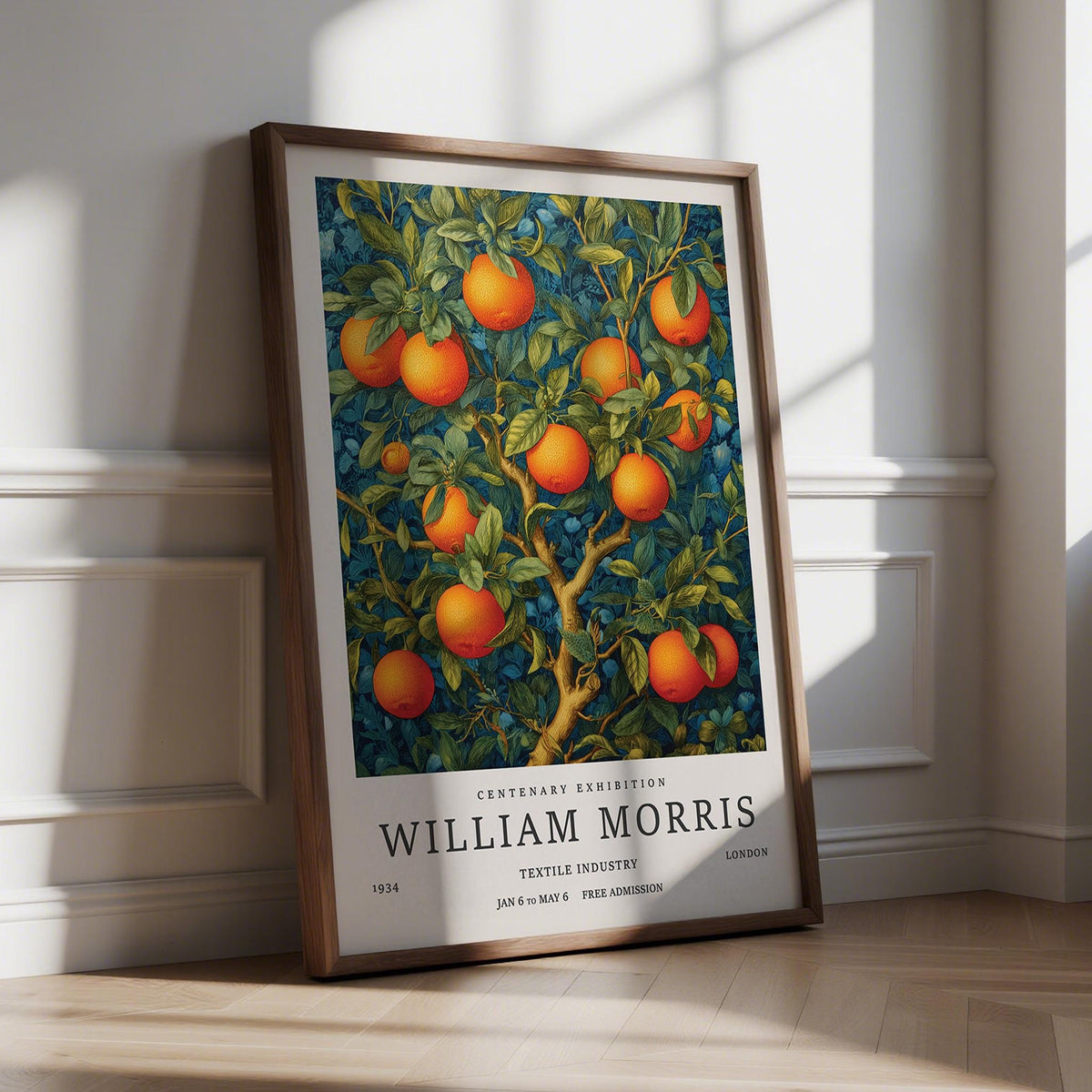 Print leaning on a floor of an orange tree with bright fruit against dark leafy background