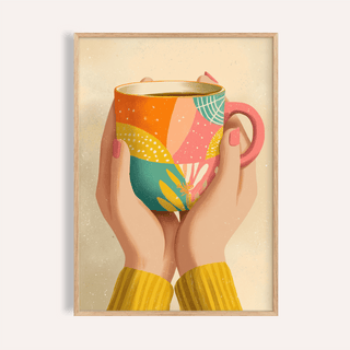 Framed Coffee Mug Art showing hands with pink nails holding a colourful patterned mug