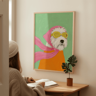 Funny Pet Poster print of a dog with aviator goggles and a pink scarf hanging above a desk with a plant