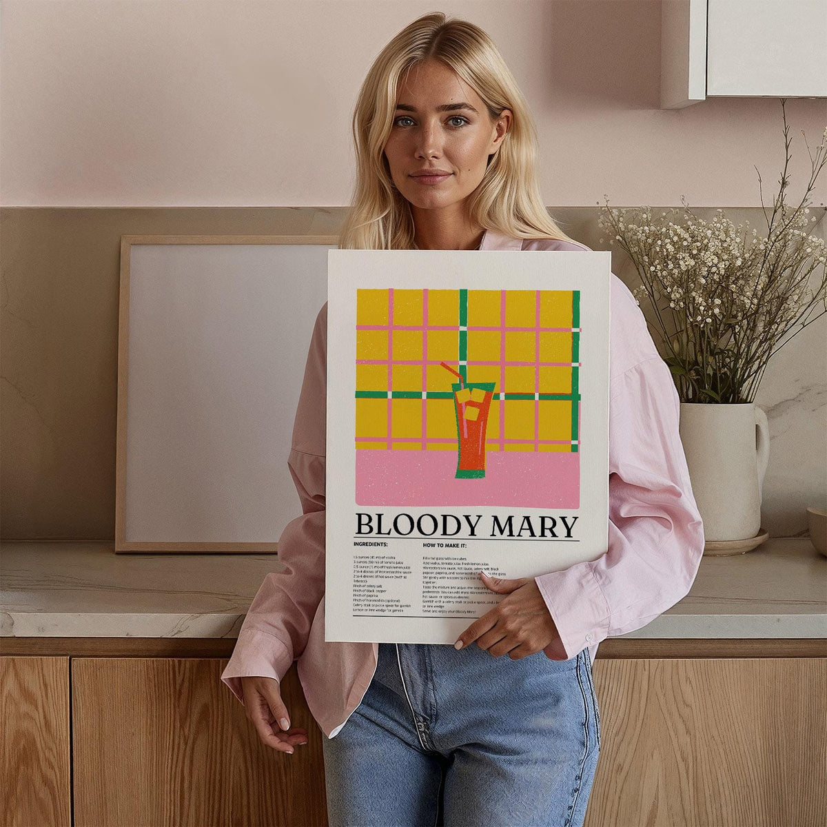 Person holding Retro Drink Poster with minimalist Bloody Mary illustration and typographic text