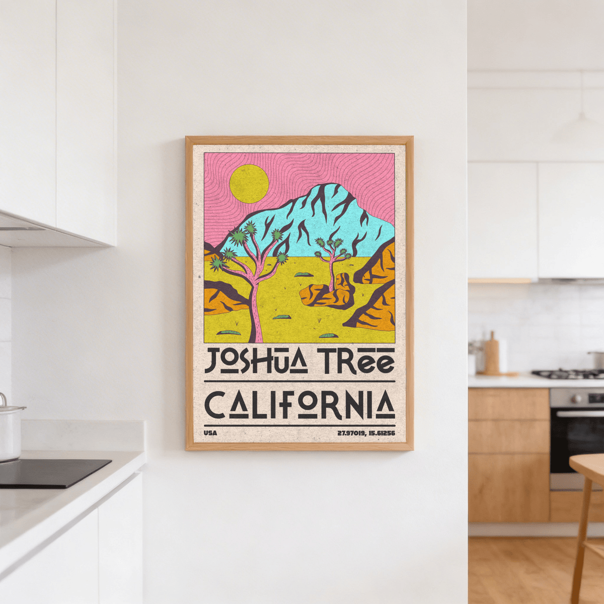 Joshua Tree art print with bright blue mountain and pink sky on kitchen wall near stove