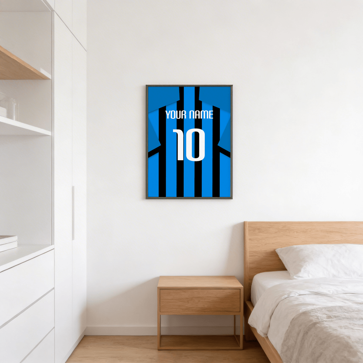 Football Shirt Poster in Black and Blue Stripes with Blue Sleeves above a wooden bedside table in a bedroom
