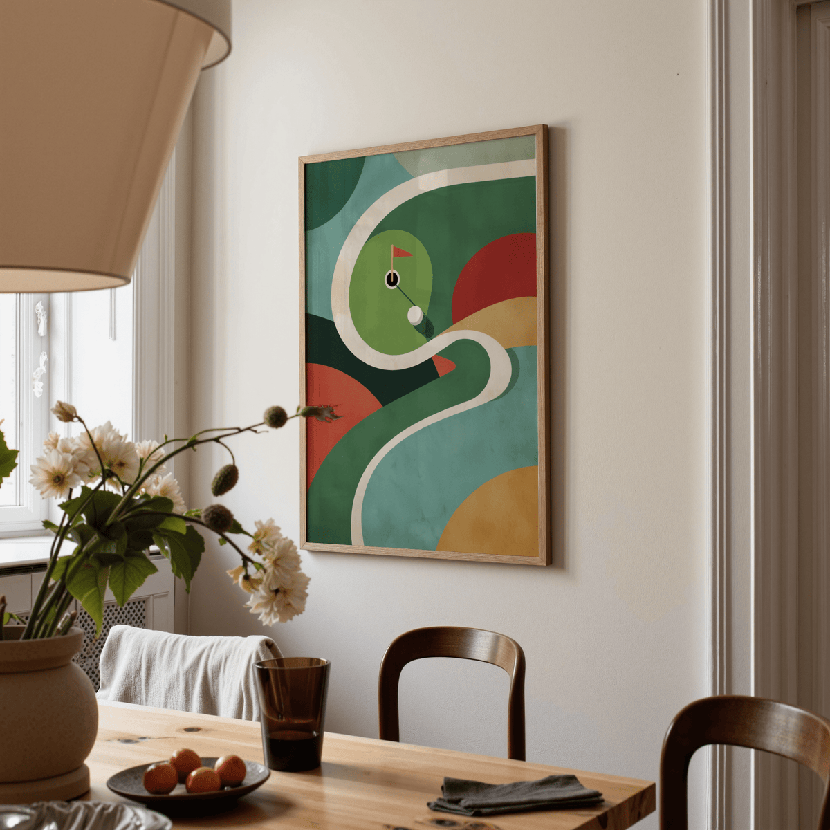 Print on a wall in a dining room of an abstract mini golf course in green red and beige tones