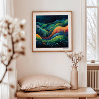 Scenic wall art of abstract colourful hills above a beige cushion and vase