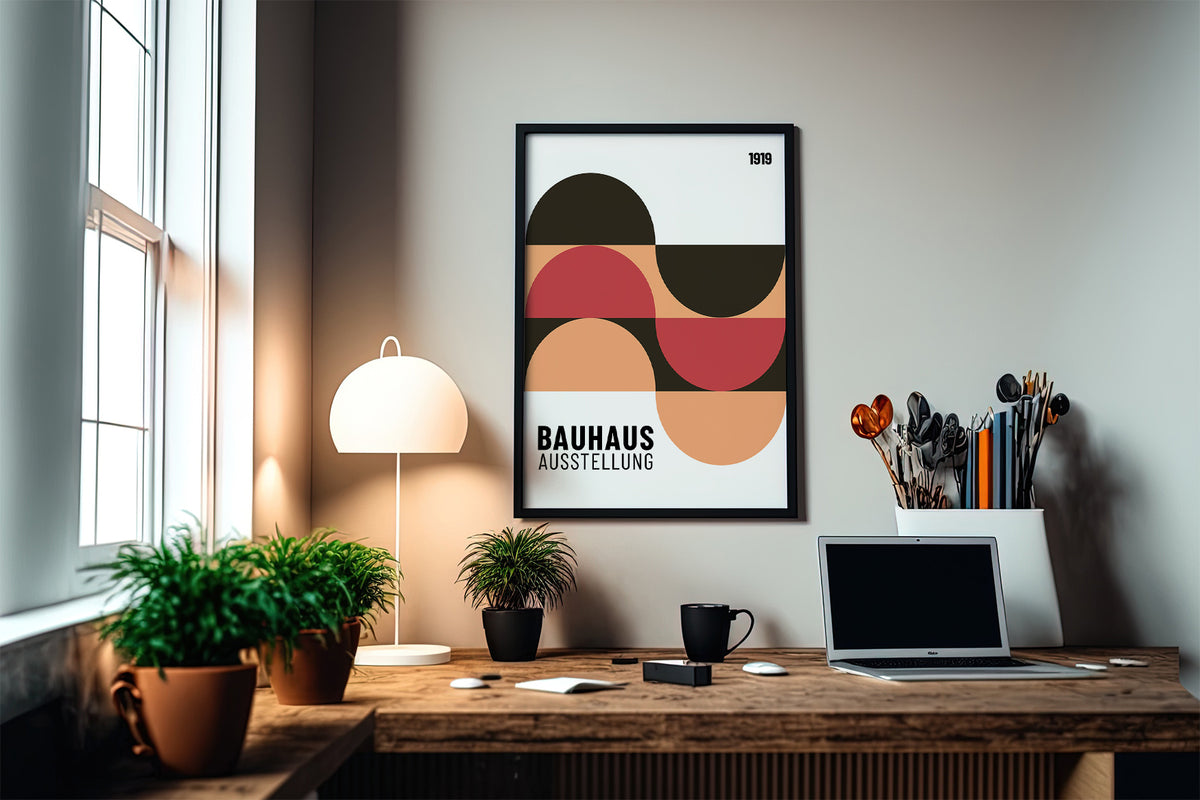 Home Office Wall Art with abstract geometric shapes in muted red and peach above a desk with a laptop