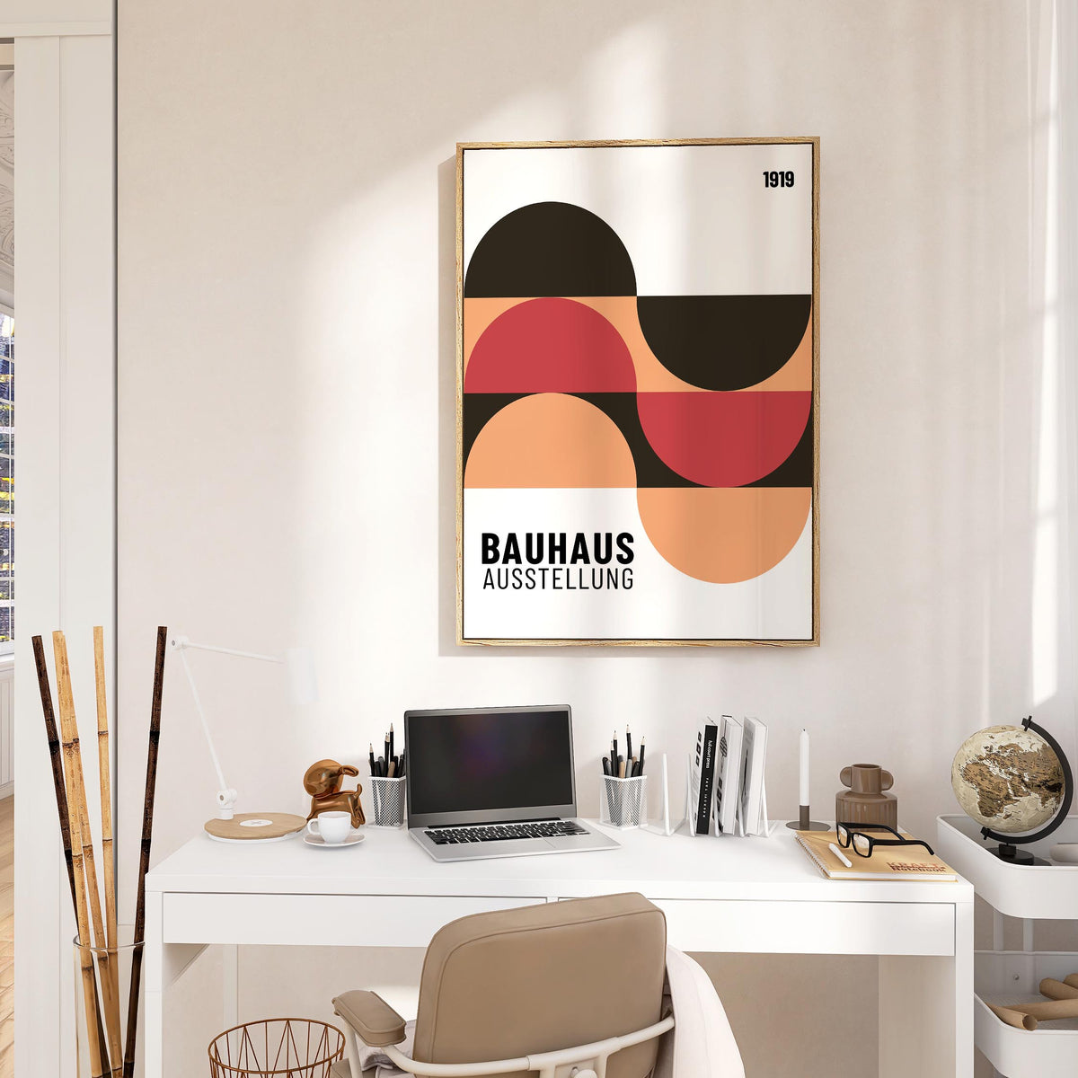Home Office Wall Art framed print with abstract geometric shapes in black, red and peach above a white desk