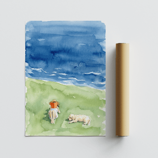 Unframed Reading By The Sea Art Print showing a person reading with a dog beside a packaging tube