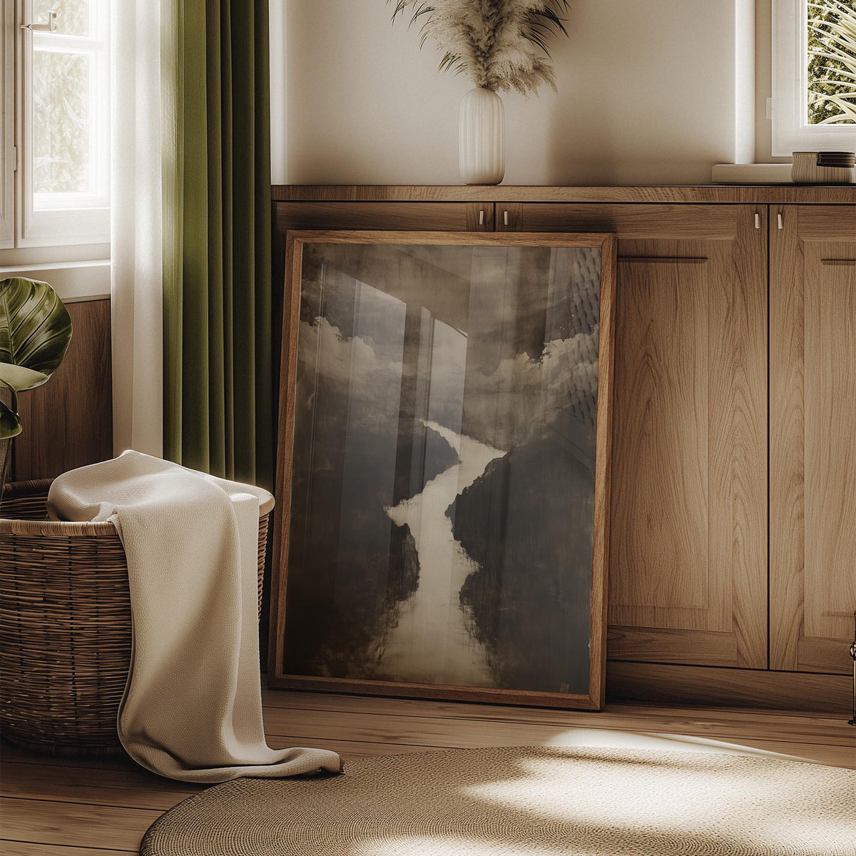 Print leaning on a wooden floor in a sunlit room with a basket and green curtain