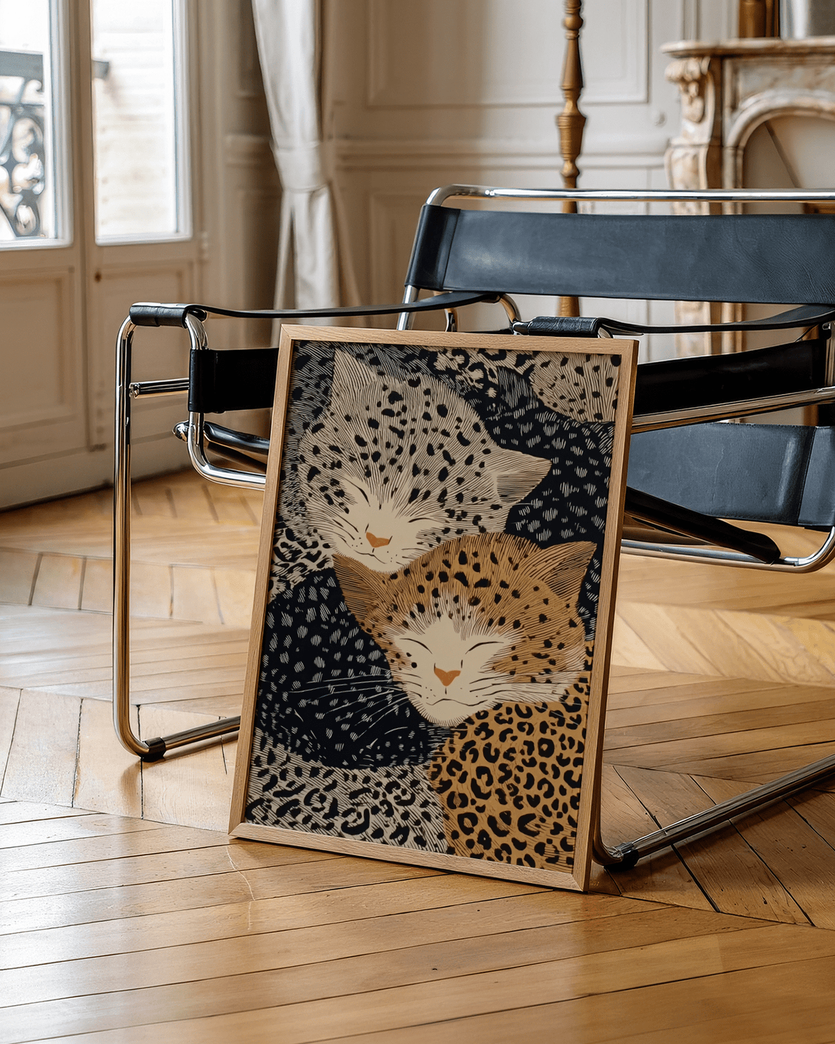 Leopard Print wall art of two sleeping leopards with beige and orange tones leaning on a black chair