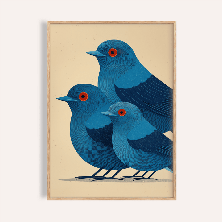 Close-up of blue bird art print of three blue birds with red eyes in a minimalist style