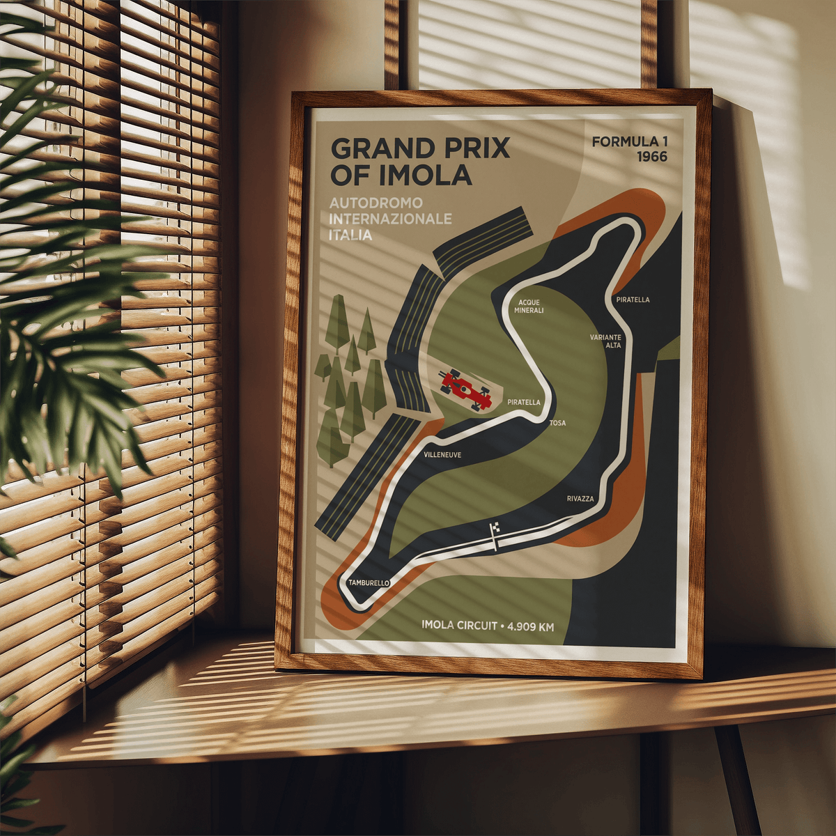 Framed Imola Circuit Map Poster with minimalist race track design and retro colours on a wooden shelf