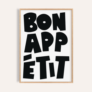 Framed close-up of French art prints with black bold typographic text saying Bon Appétit on white background