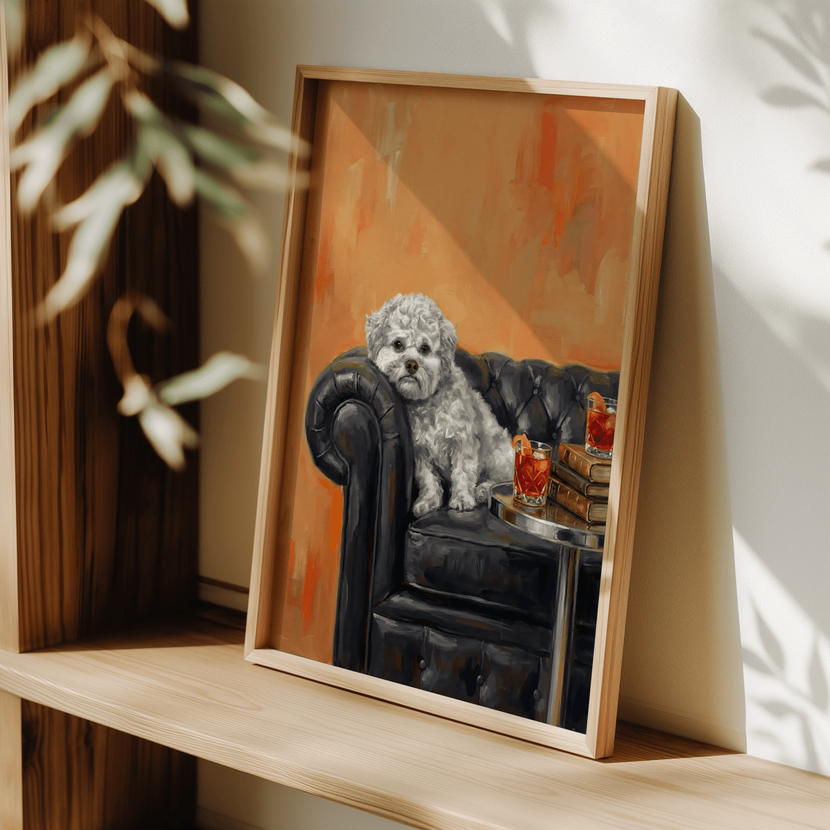 Framed Dog with Human Face wall art featuring a white dog on a black leather sofa with orange background leaning on a wooden shelf