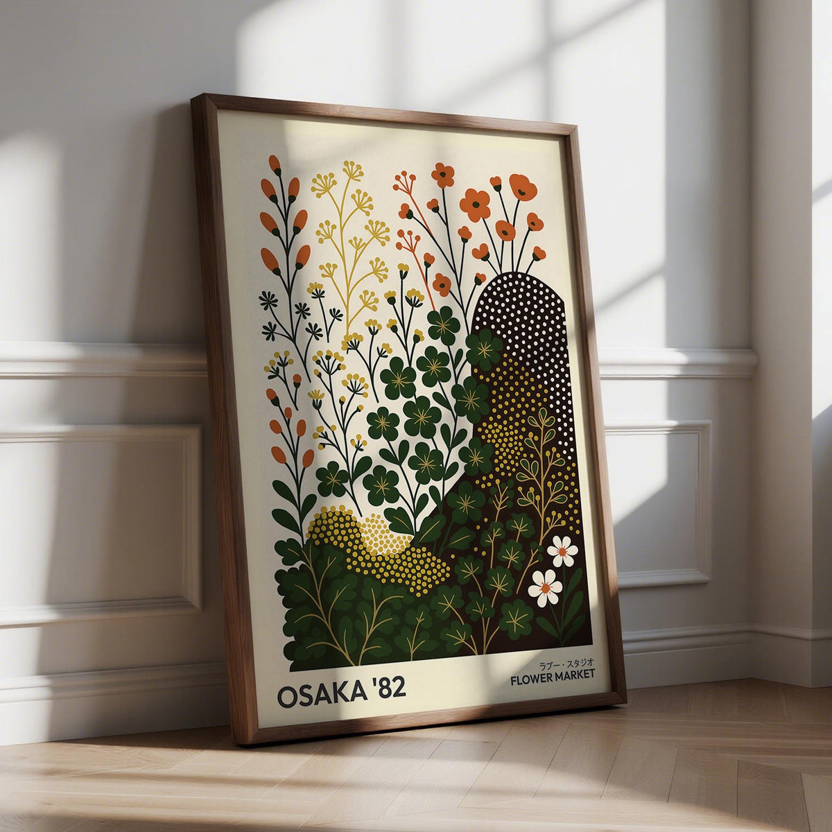 Framed modern nature wall art print of minimalist clover flowers in warm colours leaning on floor