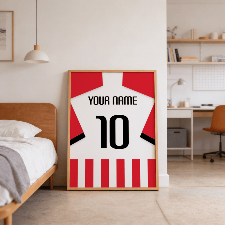 Football Shirt Poster in Red and White Stripes with Black Number leaning on the bedroom floor beside the bed