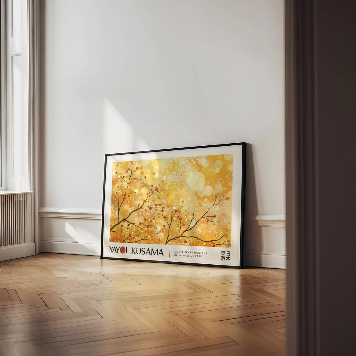 Landscape poster leaning on floor with abstract branches and yellow and orange tones in a bright room