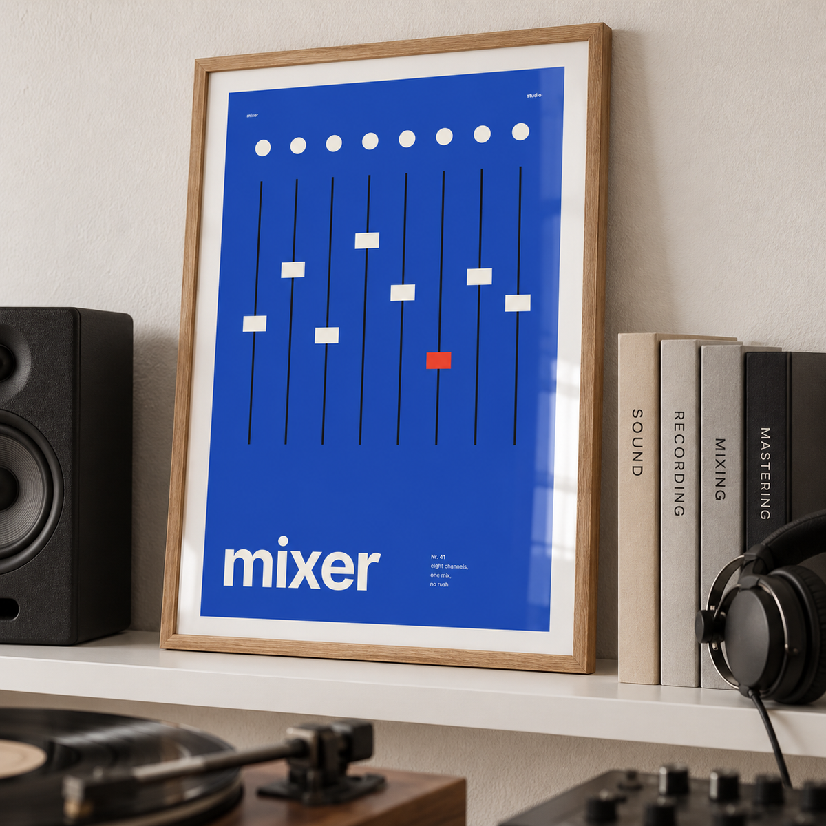 Mixing desk faders print leaning on a picture ledge in a music room